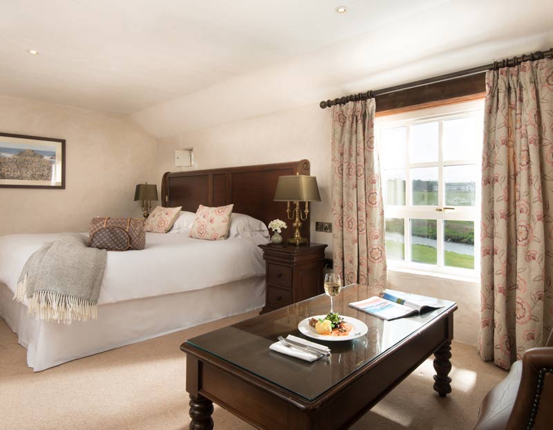 The Mill House Delux Bedroom with Coffee Table